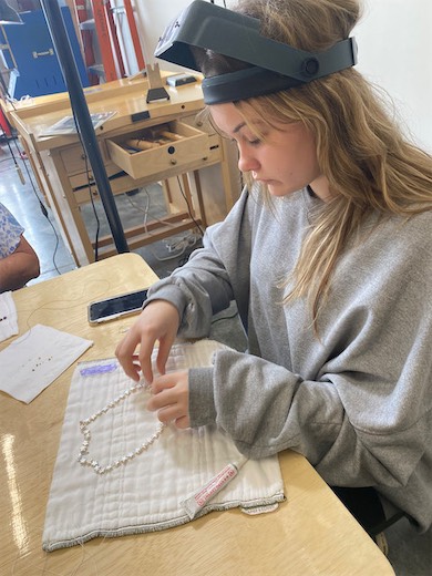 Student working at a jewelry-making bench