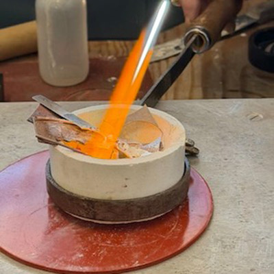 Glowing casting material in a studio crucible